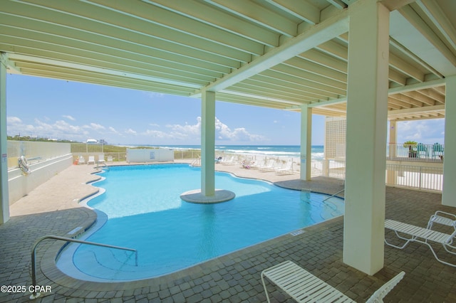 14401 Front Beach Rd Unit 206, Panama City Beach, FL 32413 - community pool with a patio area, a fenced backyard, and a water view
