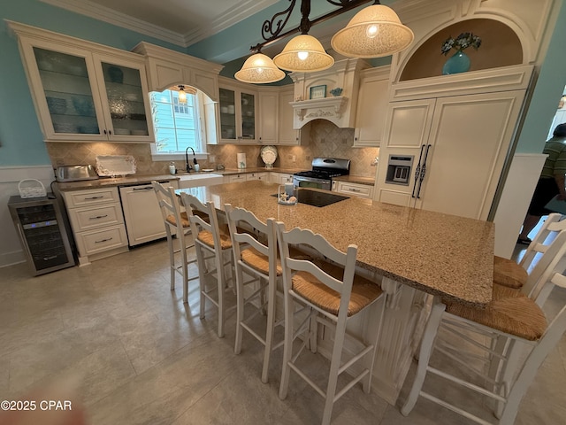 kitchen with stainless steel gas range, dishwashing machine, a sink, tasteful backsplash, and beverage cooler