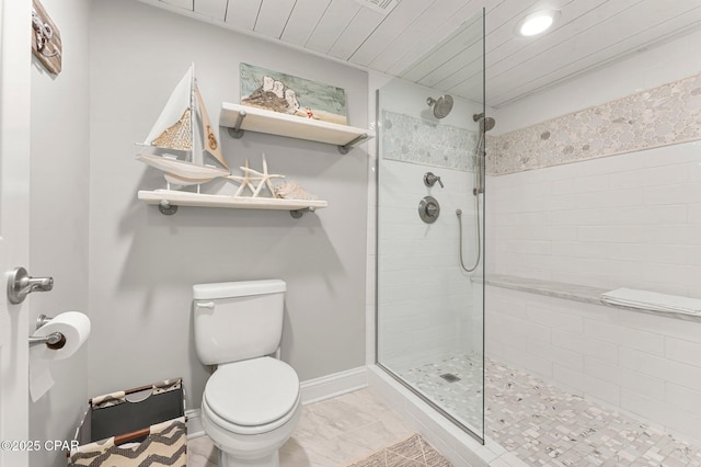 6905 Thomas Dr Unit 807, Panama City Beach, FL 32408 - full bath with a tile shower, toilet, baseboards, marble finish flooring, and recessed lighting