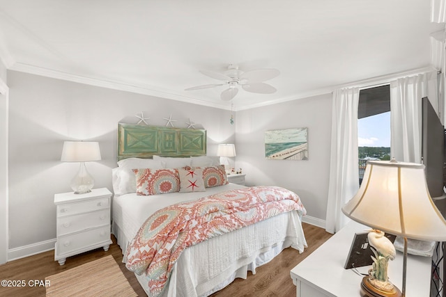6905 Thomas Dr Unit 807, Panama City Beach, FL 32408 - bedroom with wood finished floors, baseboards, ornamental molding, and a ceiling fan