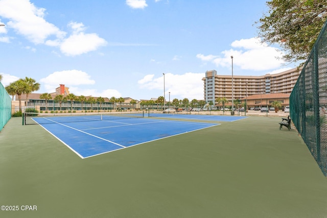 6905 Thomas Dr Unit 807, Panama City Beach, FL 32408 - view of tennis court featuring fence