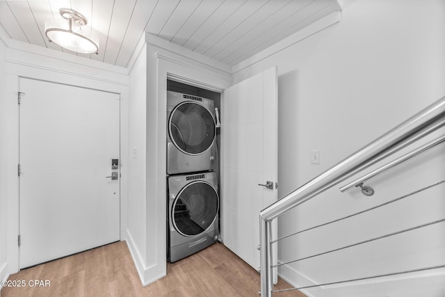 17735 Front Beach Rd Unit 4, Panama City Beach, FL 32413 - laundry area featuring estacked washer and dryer, light wood-type flooring, and wooden ceiling