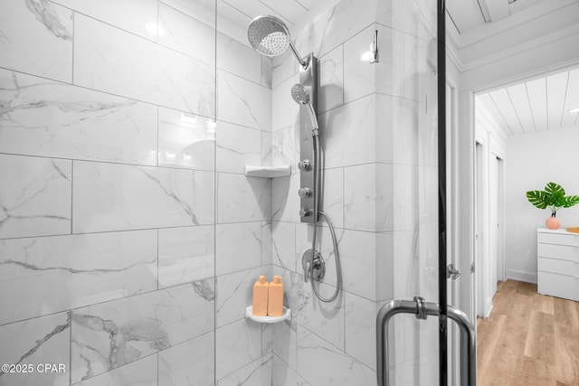 17735 Front Beach Rd Unit 4, Panama City Beach, FL 32413 - full bathroom with a stall shower, wood finished floors, and ornamental molding
