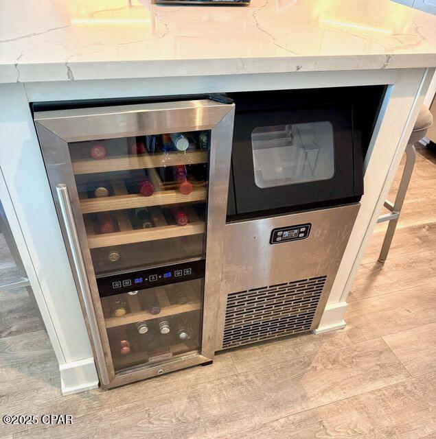 17735 Front Beach Rd Unit 4, Panama City Beach, FL 32413 - detailed view of wine cooler and wood finished floors