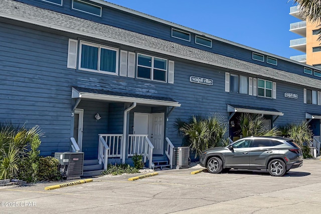 17735 Front Beach Rd Unit 4, Panama City Beach, FL 32413 - view of front of home featuring uncovered parking and central AC unit