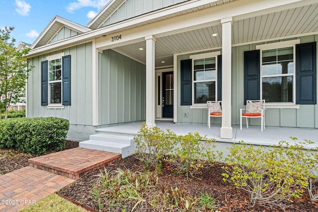 3104 Heartleaf E Ave, Panama City, FL 32405 - doorway to property with board and batten siding and covered porch
