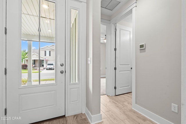 3104 Heartleaf E Ave, Panama City, FL 32405 - doorway with baseboards and light wood-style floors