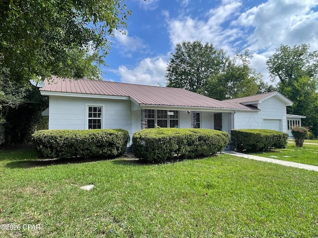 4276 2nd Ave, Marianna, FL 32446 - single story home with a garage, a front lawn, and metal roof