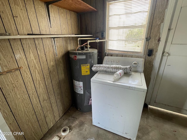 4276 2nd Ave, Marianna, FL 32446 - laundry area with washer / dryer, water heater, and wooden walls