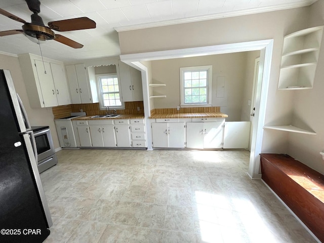 4276 2nd Ave, Marianna, FL 32446 - kitchen featuring a sink, freestanding refrigerator, ornamental molding, stainless steel electric stove, and a ceiling fan