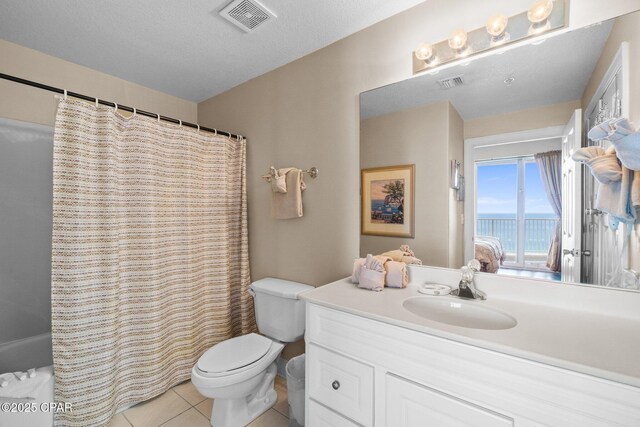 17545 Front Beach Rd Unit 1705, Panama City Beach, FL 32413 - bathroom with vanity, toilet, a water view, tile patterned flooring, and ensuite bathroom