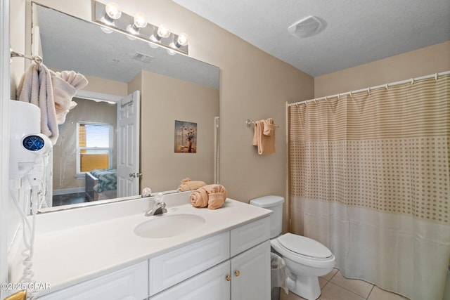 17545 Front Beach Rd Unit 1705, Panama City Beach, FL 32413 - bathroom featuring toilet, vanity, tile patterned floors, a textured ceiling, and ensuite bath