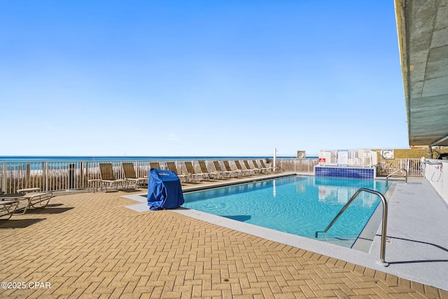 17545 Front Beach Rd Unit 1705, Panama City Beach, FL 32413 - community pool with fence, a patio, and a water view