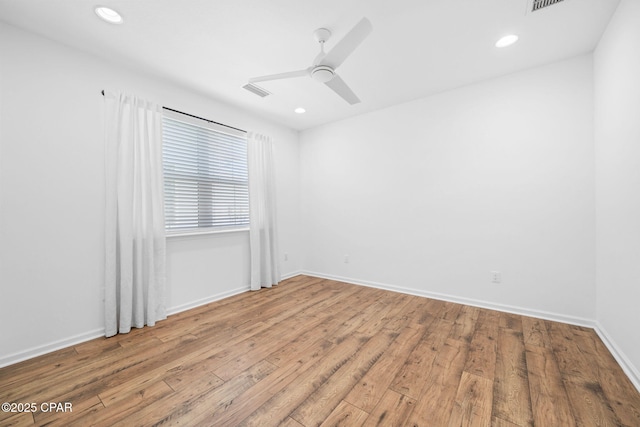 8676 Coral Reef Way, Panama City Beach, FL 32413 - unfurnished room with wood-type flooring, a ceiling fan, baseboards, and recessed lighting