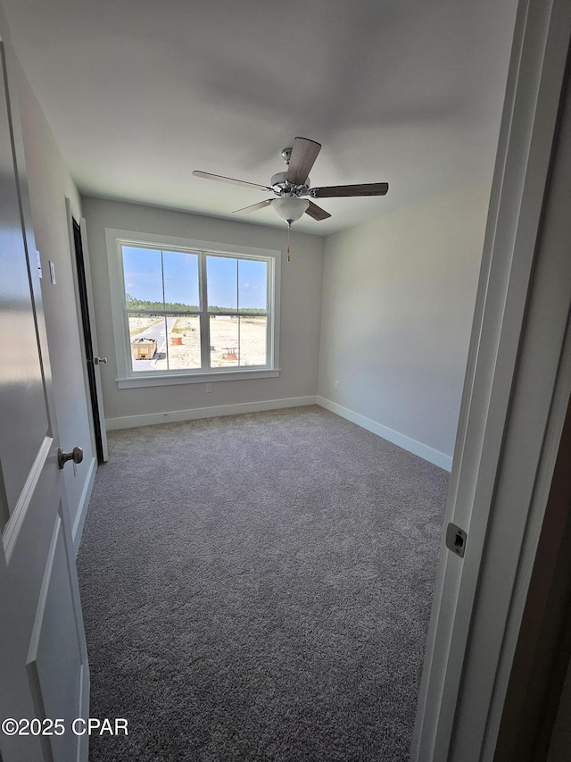 237 Skylah Ln Unit 19, Panama City Beach, FL 32407 - carpeted spare room with ceiling fan and baseboards