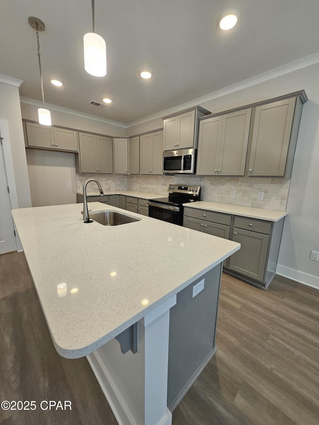 237 Skylah Ln Unit 19, Panama City Beach, FL 32407 - kitchen featuring stainless steel appliances, gray cabinetry, a sink, dark wood-style floors, and crown molding