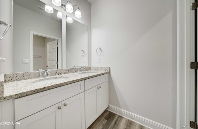 4862 Sweetspire Dr, Panama City, FL 32404 - bathroom featuring double vanity and wood finished floors