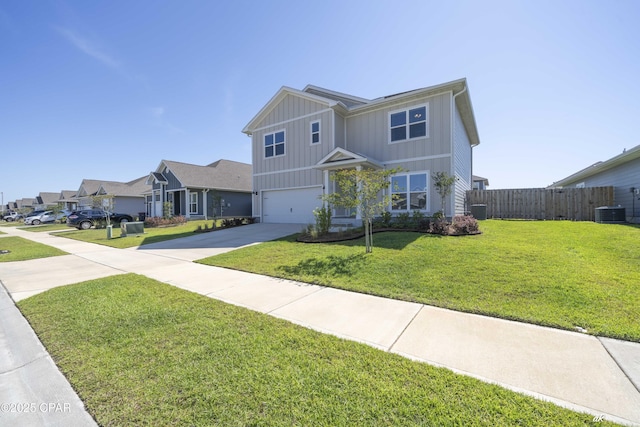 4862 Sweetspire Dr, Panama City, FL 32404 - view of front facade featuring driveway, a garage, board and batten siding, and a residential view