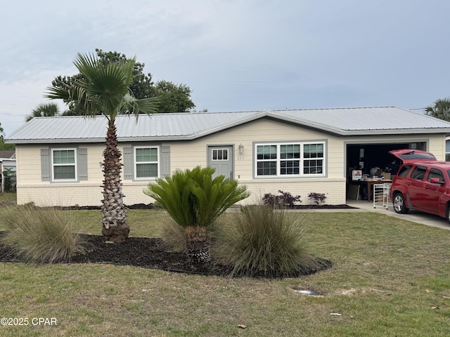 211 Santo Thomas St, Panama City Beach, FL 32413 - ranch-style house with brick siding, an attached garage, a front yard, and metal roof