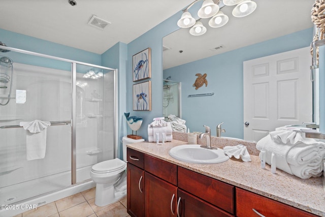 9860 S Thomas Dr Unit 802, Panama City, FL 32408 - bathroom featuring tile patterned floors, a shower stall, vanity, and toilet