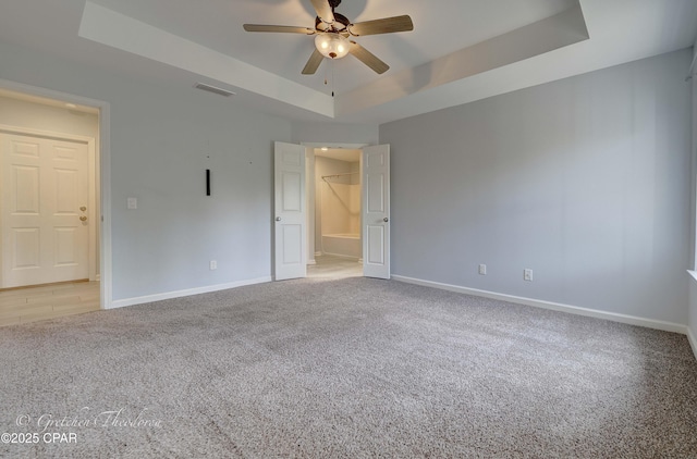 3549 Azalea Way, Panama City, FL 32405 - unfurnished room featuring a raised ceiling, carpet floors, ceiling fan, and baseboards