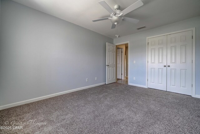 3549 Azalea Way, Panama City, FL 32405 - unfurnished bedroom with carpet, baseboards, a closet, and a ceiling fan