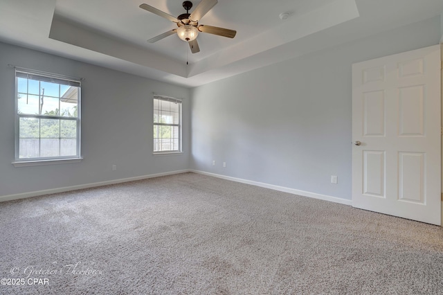 3549 Azalea Way, Panama City, FL 32405 - spare room with a raised ceiling, baseboards, carpet flooring, and a ceiling fan