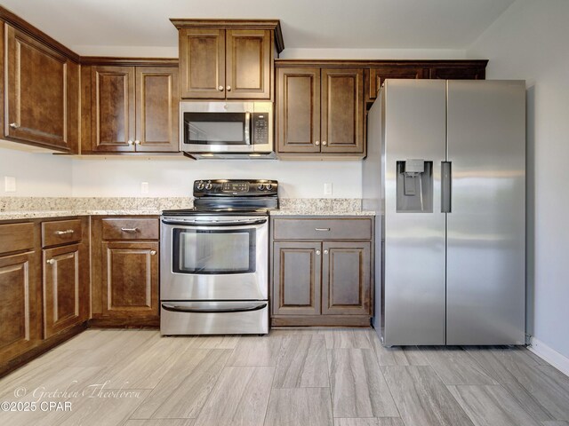 3549 Azalea Way, Panama City, FL 32405 - kitchen featuring stainless steel appliances and light stone counters