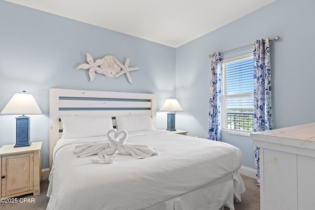 carpeted bedroom with baseboards