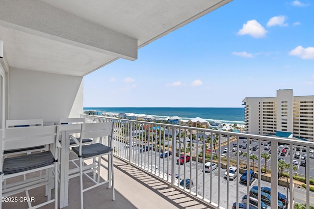 balcony featuring a water view