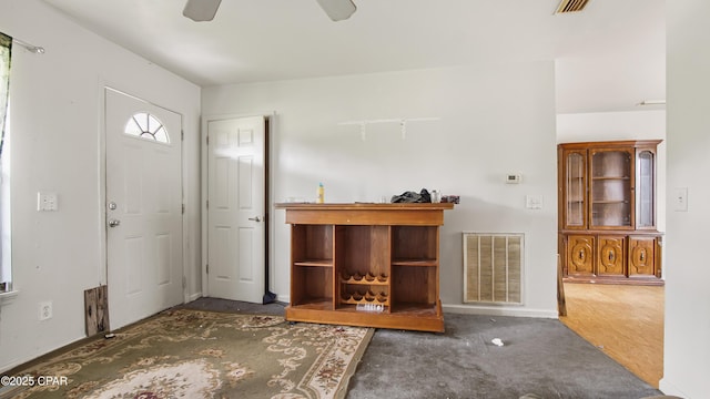 entrance foyer with ceiling fan