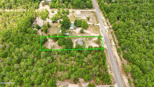 aerial view of property and surrounding area featuring property boundaries highlighted
