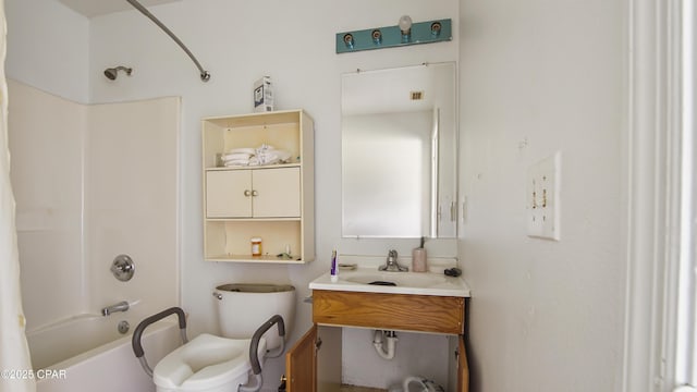bathroom with shower / tub combination, toilet, and a sink