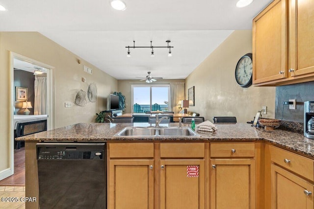 16701 Front Beach Rd Unit 306, Panama City Beach, FL 32413 - kitchen featuring dishwasher, a sink, a ceiling fan, a peninsula, and dark stone countertops
