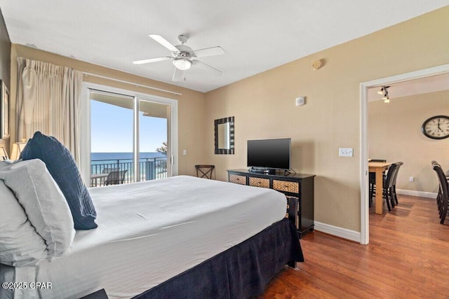 16701 Front Beach Rd Unit 306, Panama City Beach, FL 32413 - bedroom with access to outside, baseboards, wood finished floors, and a ceiling fan
