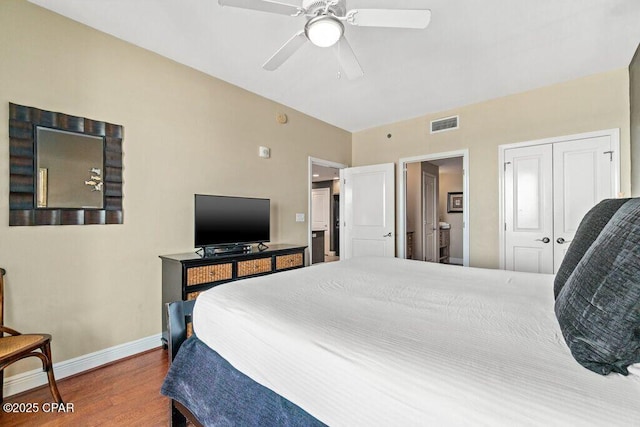 16701 Front Beach Rd Unit 306, Panama City Beach, FL 32413 - bedroom featuring wood finished floors, baseboards, ceiling fan, and a closet