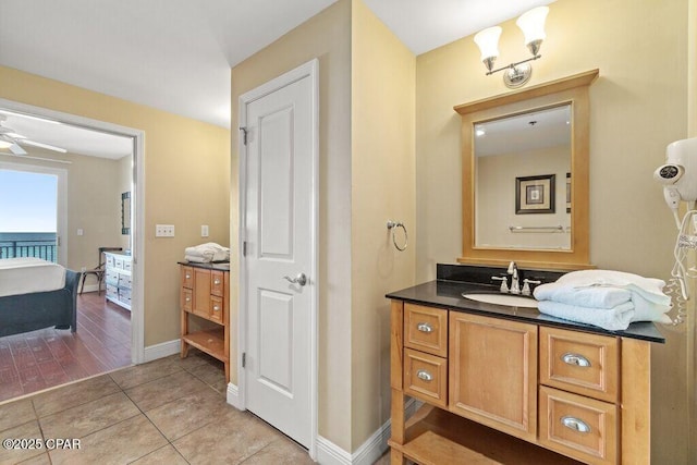 16701 Front Beach Rd Unit 306, Panama City Beach, FL 32413 - bathroom featuring vanity, a ceiling fan, tile patterned floors, and baseboards