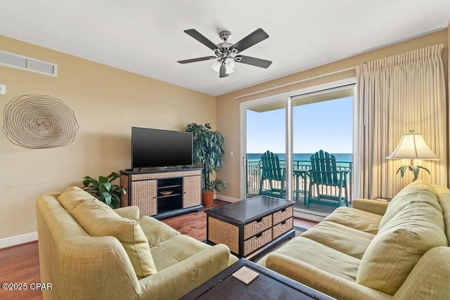 16701 Front Beach Rd Unit 306, Panama City Beach, FL 32413 - living room with baseboards, wood finished floors, and ceiling fan
