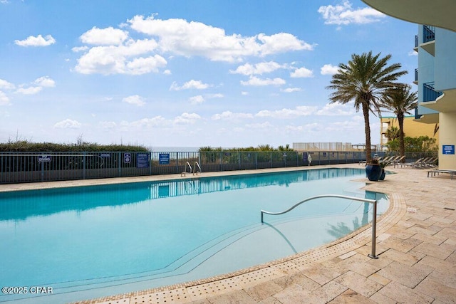 16701 Front Beach Rd Unit 306, Panama City Beach, FL 32413 - community pool featuring a patio