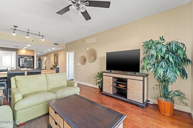 16701 Front Beach Rd Unit 306, Panama City Beach, FL 32413 - living area featuring a ceiling fan, wood finished floors, and baseboards