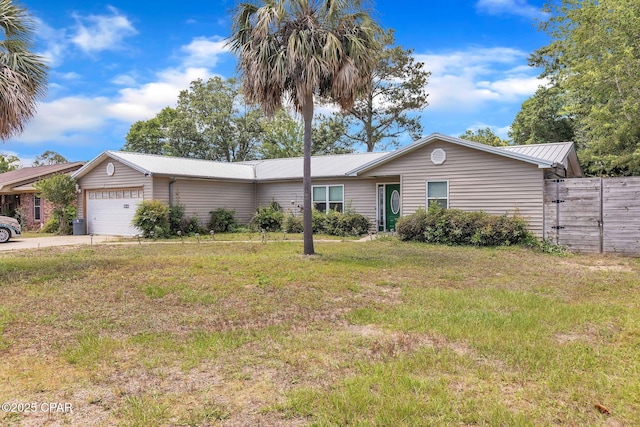 2322 Silversides Loop, Pensacola, FL 32526 - ranch-style house featuring metal roof, an attached garage, and concrete driveway
