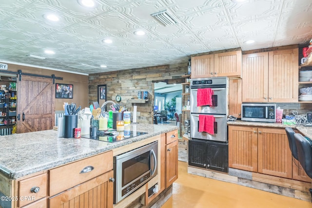 2322 Silversides Loop, Pensacola, FL 32526 - kitchen with open shelves, appliances with stainless steel finishes, a barn door, an ornate ceiling, and concrete floors