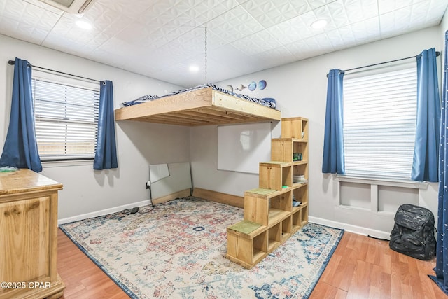 2322 Silversides Loop, Pensacola, FL 32526 - bedroom featuring wood finished floors and baseboards