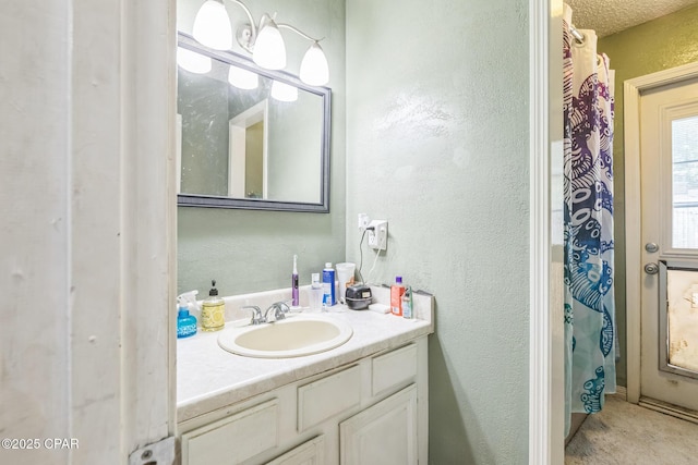 2322 Silversides Loop, Pensacola, FL 32526 - full bathroom with vanity, a textured wall, and curtained shower