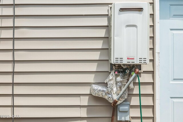 2322 Silversides Loop, Pensacola, FL 32526 - stairs with water heater