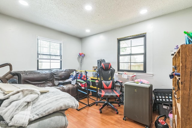 2322 Silversides Loop, Pensacola, FL 32526 - bedroom with wood finished floors, recessed lighting, a textured ceiling, and radiator