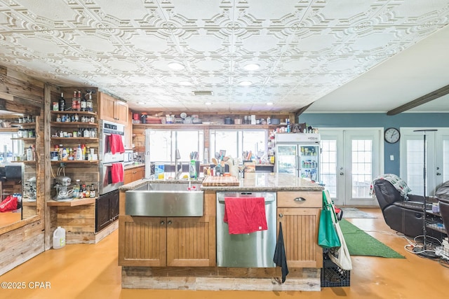 2322 Silversides Loop, Pensacola, FL 32526 - kitchen featuring stainless steel appliances, a sink, an ornate ceiling, a center island with sink, and open shelves