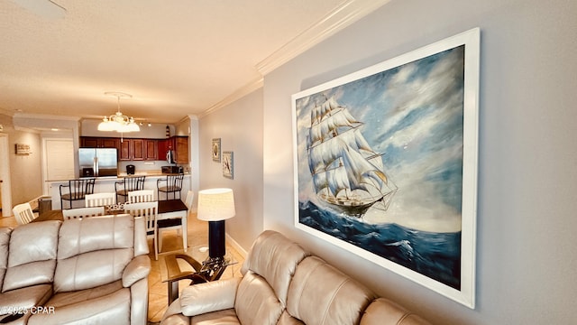 17643 Front Beach Rd Unit 1704, Panama City Beach, FL 32413 - living area featuring crown molding, baseboards, and a chandelier