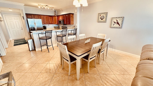 17643 Front Beach Rd Unit 1704, Panama City Beach, FL 32413 - dining room with ornamental molding, light tile patterned floors, baseboards, track lighting, and a ceiling fan