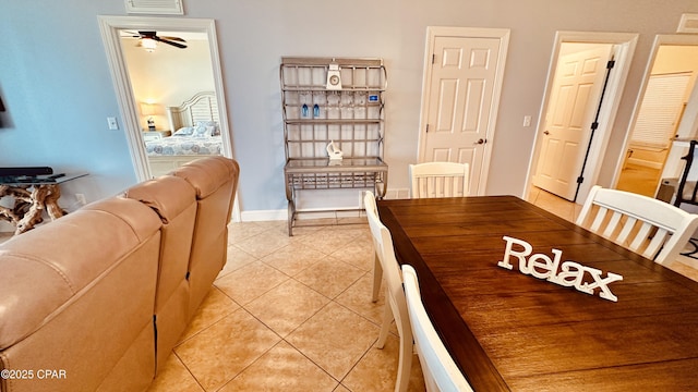 17643 Front Beach Rd Unit 1704, Panama City Beach, FL 32413 - dining space with light tile patterned floors, ceiling fan, and baseboards